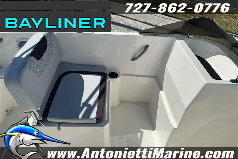 Slide: The Image of 2024 Bayliner Element M19 boat interior with seating, cup holder, and branding details. - 15