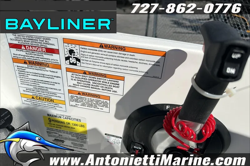 Slide: The Image of 2024 Bayliner Element M19 boat dashboard with safety warnings and controls, Antonietti Marine branding. - 22