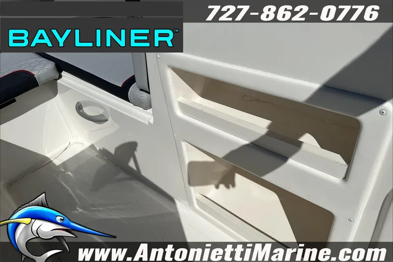 Slide: The Image of 2024 Bayliner Element M19 boat interior with storage compartments and seating. - 23
