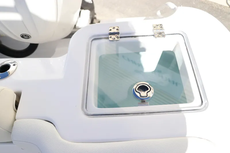 Slide: The Image of 2024 Edgewater 262CX boat livewell with transparent lid and latch. - 10