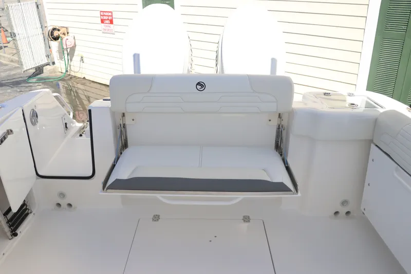 Slide: The Image of 2024 Edgewater 262CX boat with fold-down transom seat. - 19