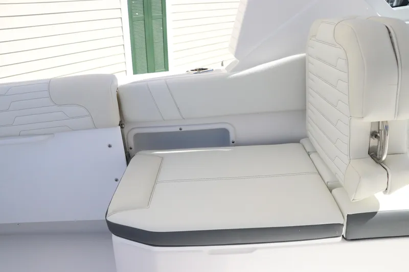 Slide: The Image of 2024 Edgewater 262CX boat interior seating with white upholstery. - 22