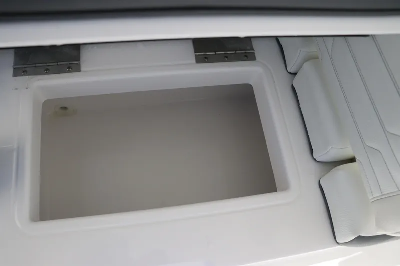 Slide: The Image of 2024 Edgewater 262CX storage compartment with white cushioned seating. - 23