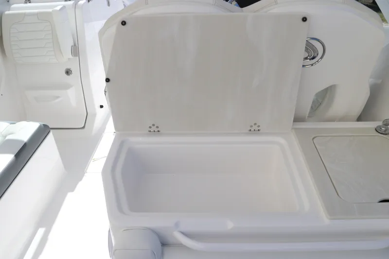 Slide: The Image of 2024 Edgewater 262CX boat interior storage compartment. - 30