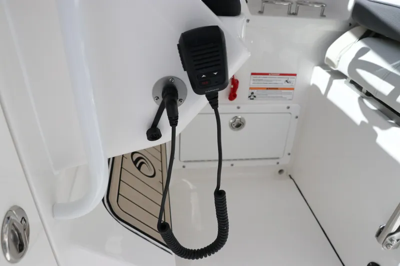 Slide: The Image of 2024 Edgewater 262CX boat interior with communication equipment. - 39