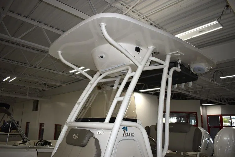 Slide: The Image of 2024 Key West 244 CC center console boat with T-top in showroom. - 12