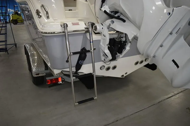 Slide: The Image of 2024 Key West 244 CC boat stern with ladder and outboard motor. - 13