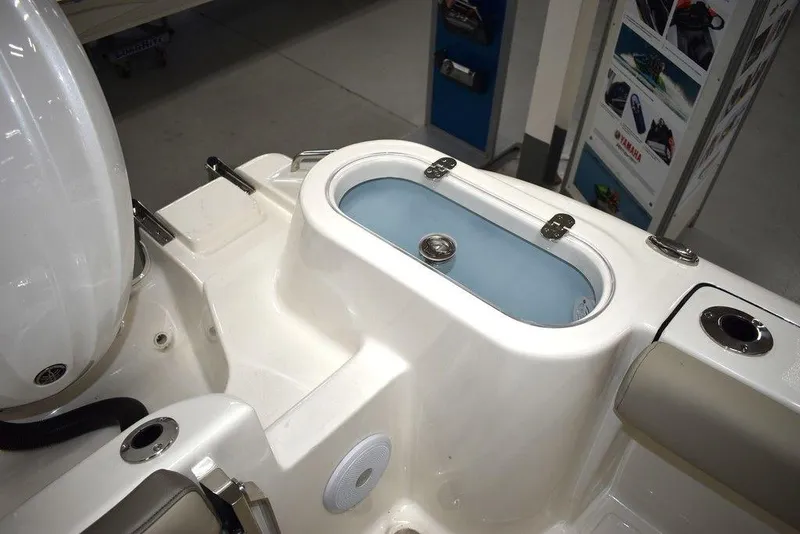 Slide: The Image of 2024 Key West 244 CC boat livewell and seating area. - 15