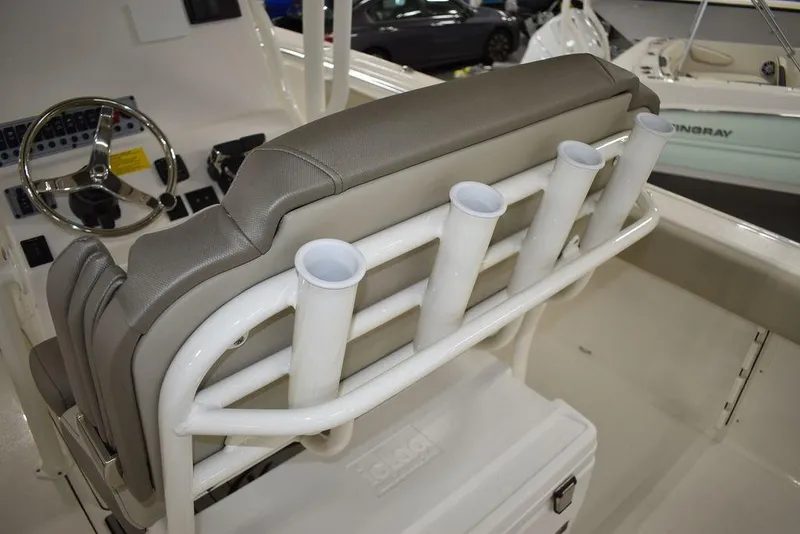 Slide: The Image of 2024 Key West 244 CC boat interior with rod holders and steering console. - 20