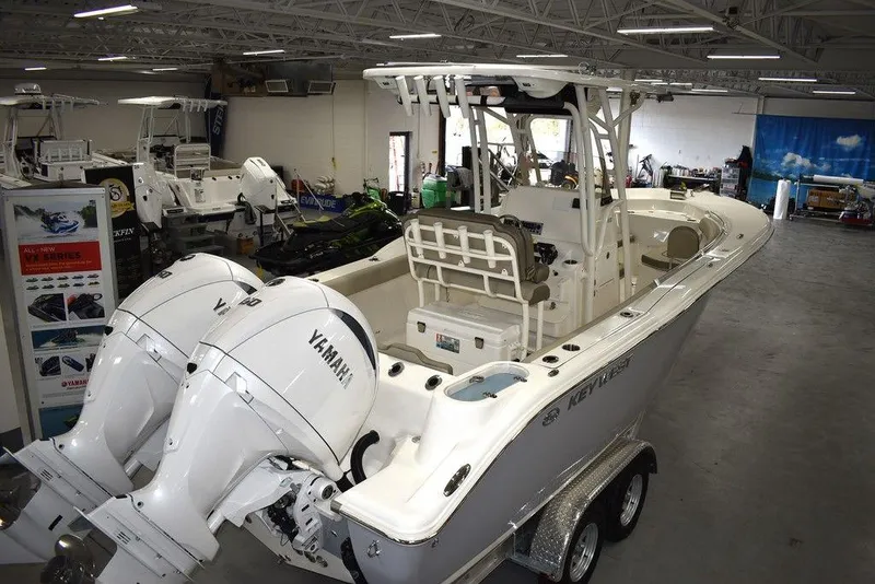 Slide: The Image of 2024 Key West 244 CC boat with twin Yamaha engines in showroom. - 3