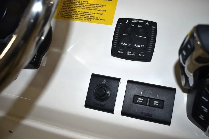 Slide: The Image of 2024 Key West 244 CC boat control panel with Yamaha start/stop buttons. - 30
