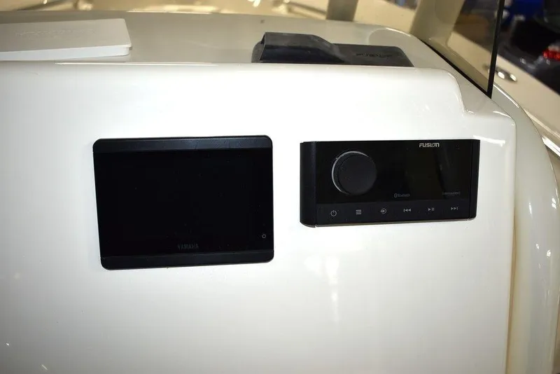 Slide: The Image of 2024 Key West 244 CC dashboard with navigation and audio controls. - 33