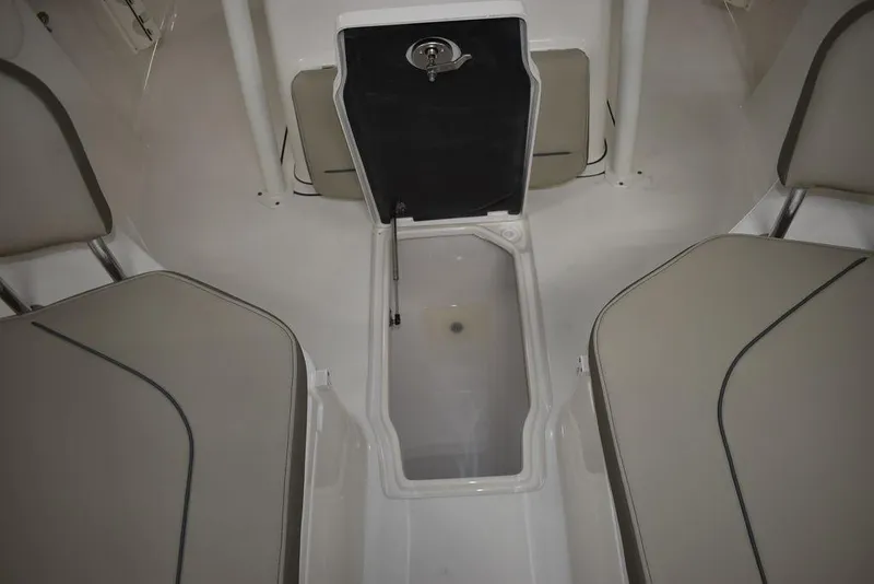 Slide: The Image of 2024 Key West 244 CC boat interior with storage compartment. - 42