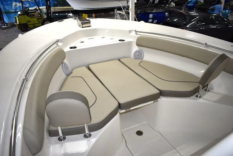 Slide: The Image of 2024 Key West 244 CC boat with cushioned seating area. - 45