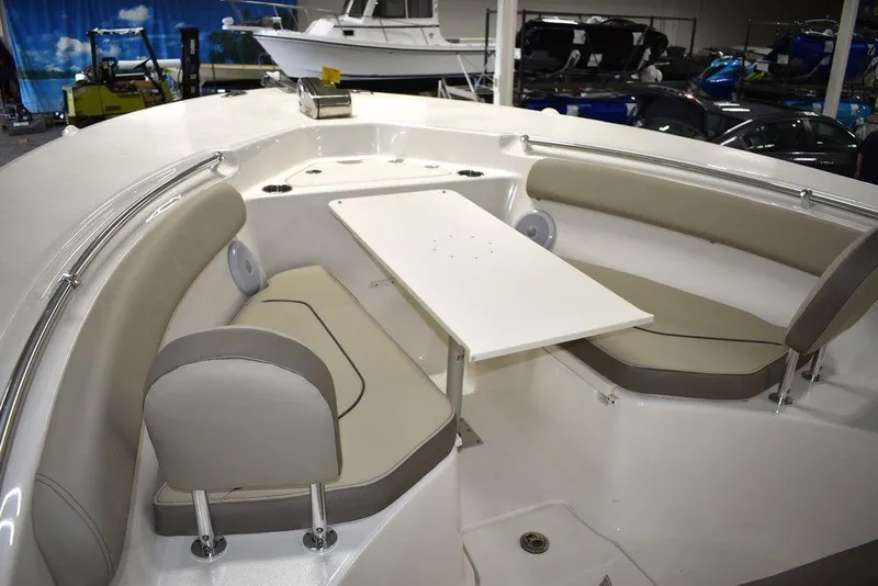 Slide: The Image of 2024 Key West 244 CC boat interior with seating and table. - 46