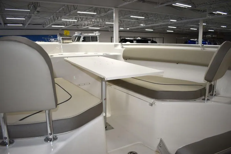 Slide: The Image of 2024 Key West 244 CC boat interior with seating and table. - 47