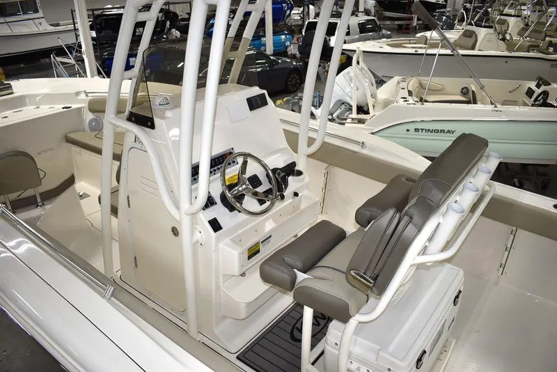 Slide: The Image of 2024 Key West 244 CC center console boat interior with helm and seating. - 8