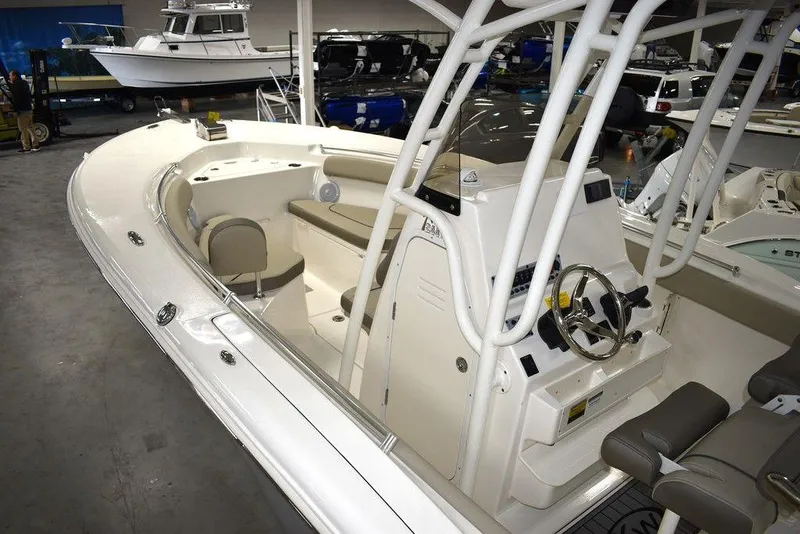 Slide: The Image of 2024 Key West 244 CC center console boat in showroom. - 9