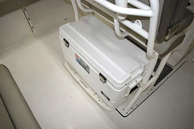 Slide: The Image of 2024 Key West 244 CC boat with a white cooler under the seat. - 17