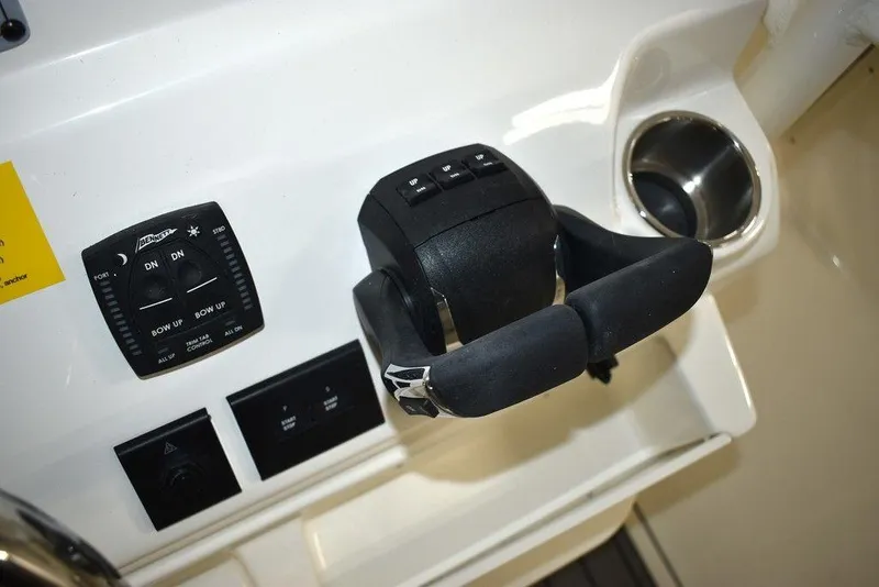 Slide: The Image of 2024 Key West 244 CC boat control panel and throttle. - 32