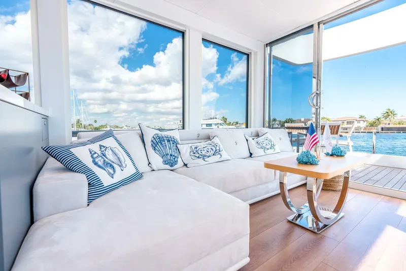 Slide: The Image of Luxurious interior of Reina L44 DR yacht, 2024 model, with ocean view and nautical-themed decor. - 22