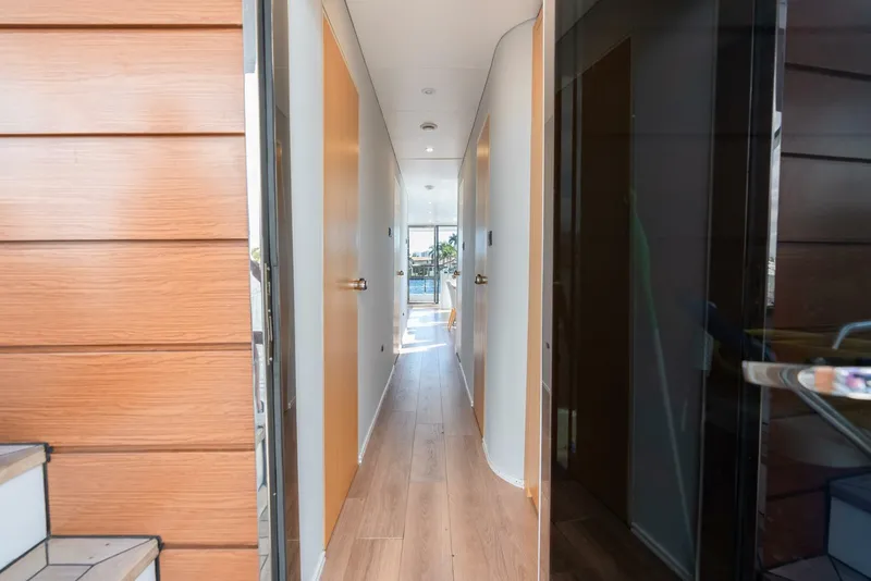 Slide: The Image of Narrow hallway with wooden flooring in Reina L44 DR yacht, 2024 model. - 23