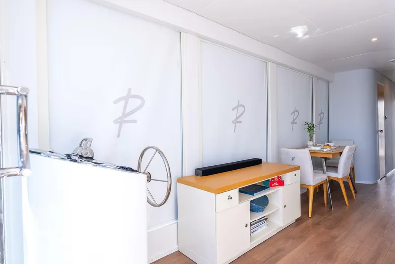 Slide: The Image of Modern interior of Reina L44 DR 2024 model with dining area and storage unit. - 24