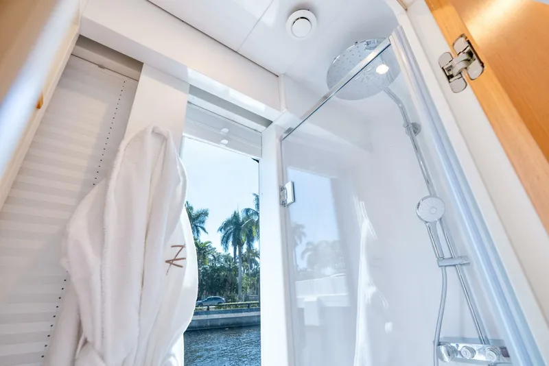 Slide: The Image of Modern Reina L44 DR 2024 yacht bathroom with shower and window view. - 28