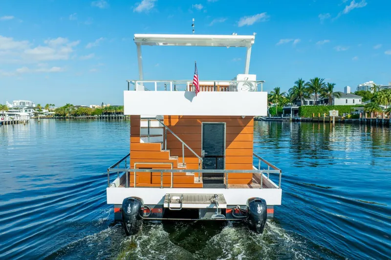 Slide: The Image of 2024 Reina L44 DR houseboat cruising on a sunny day. - 3