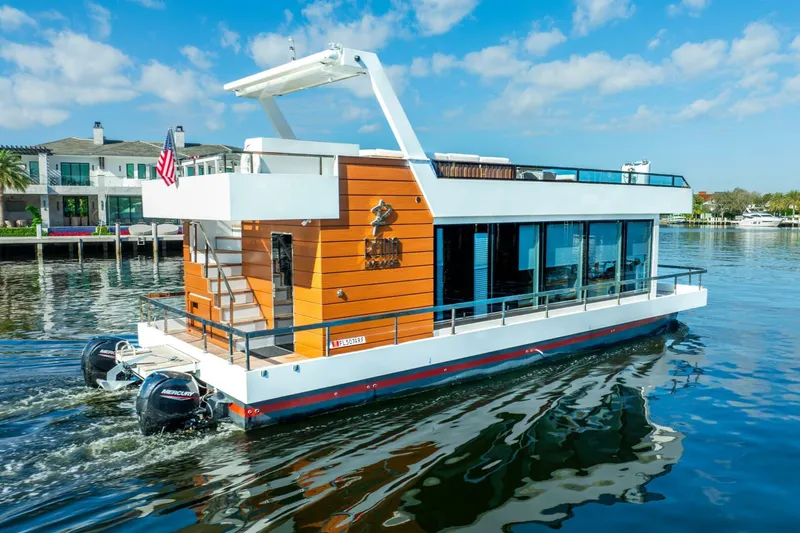 Slide: The Image of 2024 Reina L44 DR houseboat cruising on a sunny day. - 4