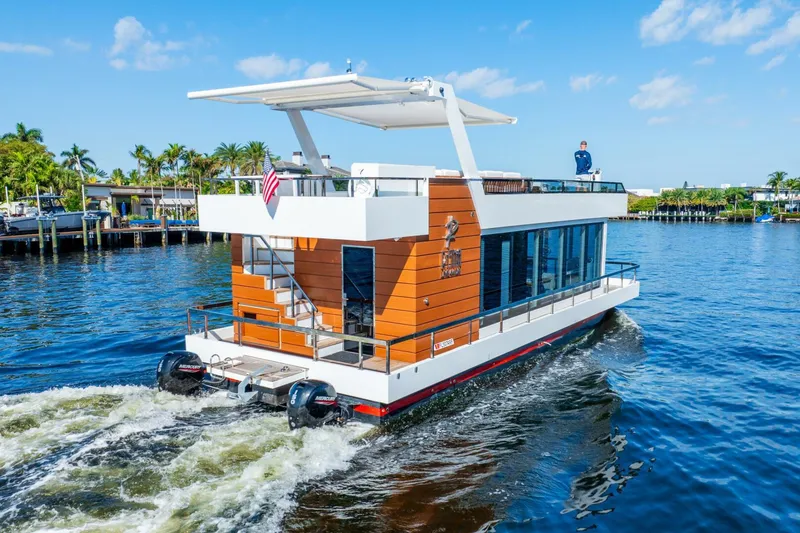 Slide: The Image of 2024 Reina L44 DR houseboat cruising on a sunny day. - 6