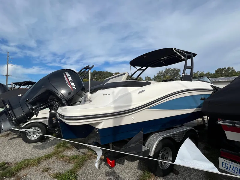Slide: The Image of 2021 Sea Ray SPO 210 boat with Mercury outboard motor on trailer. - 3