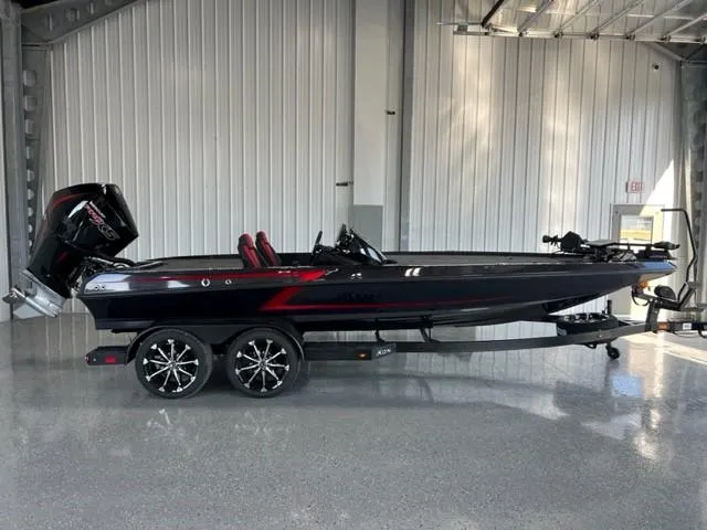 The Image of 2024 iKon LX21 black and red fishing boat in a showroom. - 0