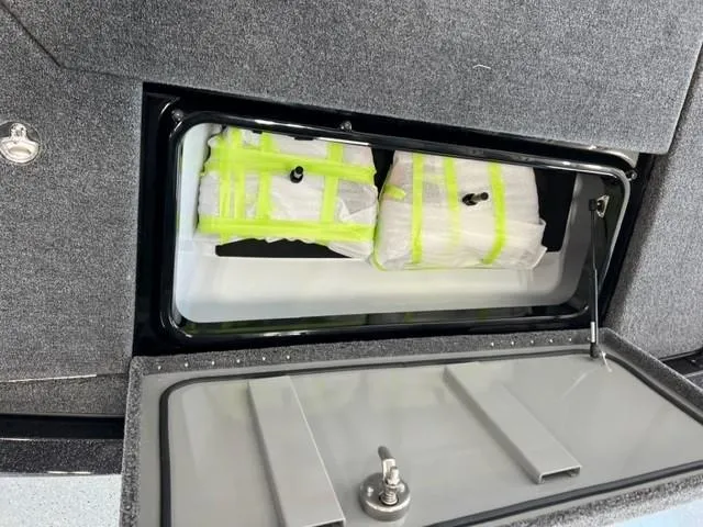 Slide: The Image of iKon LX21 2024 model storage compartment with secured items. - 18