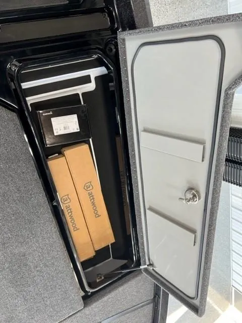 Slide: The Image of iKon LX21 2024 storage compartment with boxes and lockable door. - 19