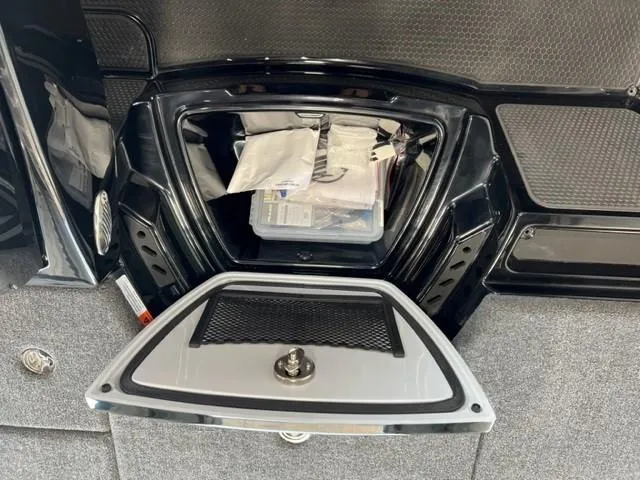Slide: The Image of Storage compartment of 2024 iKon LX21 with organized items and secure latch. - 20