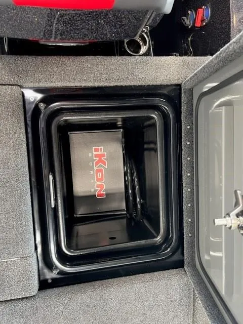 Slide: The Image of iKon LX21 2024 model storage compartment with open lid. - 23