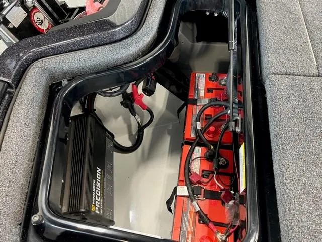 Slide: The Image of Battery compartment of 2024 iKon LX21 boat with Precision charger. - 26