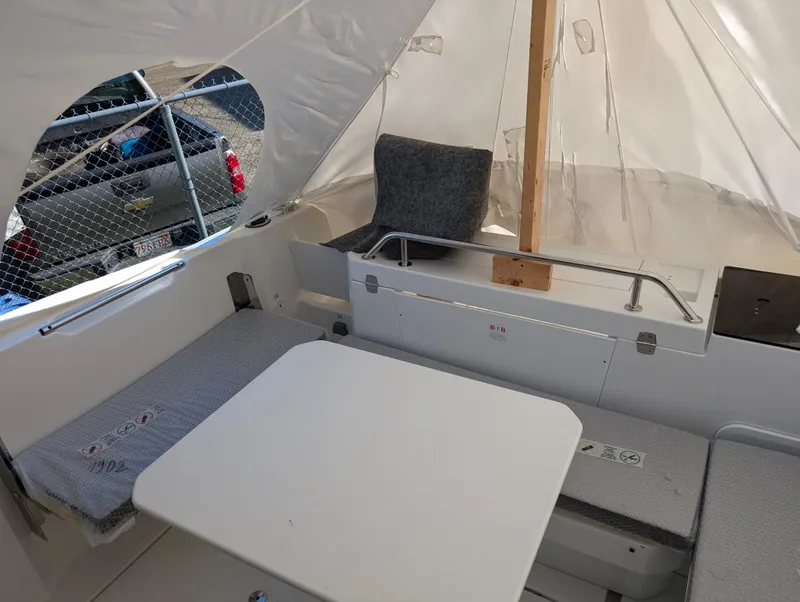 Slide: The Image of Interior of 2023 Jeanneau NC 695 Sport S2 boat with seating and table. - 10