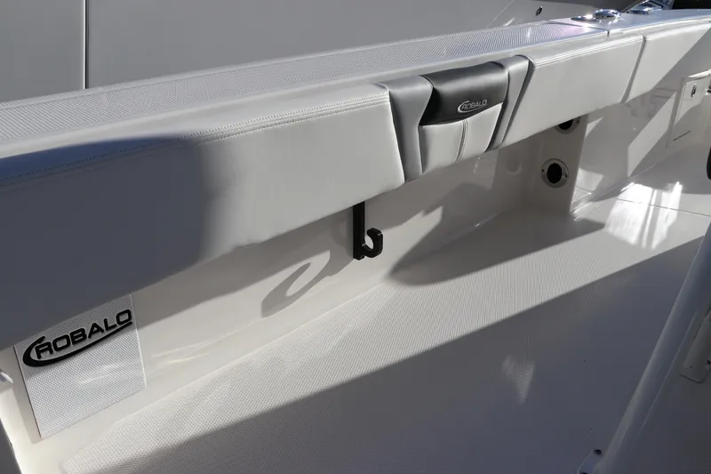 Slide: The Image of 2024 Robalo 266 Cayman boat interior detail with logo and seating. - 15