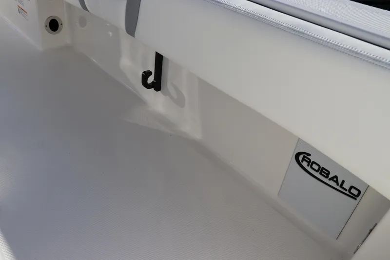 Slide: The Image of 2024 Robalo 266 Cayman boat interior with logo and hook detail. - 16