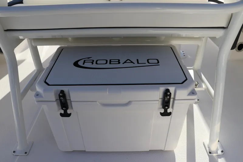 Slide: The Image of 2024 Robalo 266 Cayman boat cooler under seat, white with logo. - 17