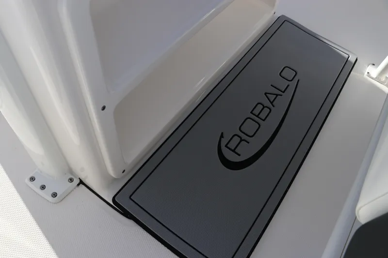 Slide: The Image of Robalo 266 Cayman 2024 boat deck with branded mat. - 22