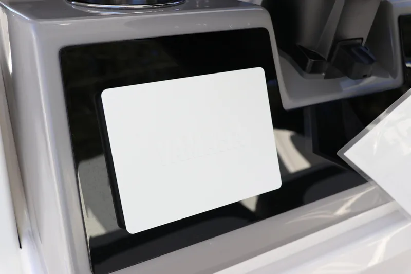 Slide: The Image of 2024 Robalo 266 Cayman dashboard detail with blank display screen. - 25