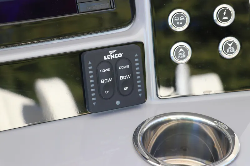 Slide: The Image of 2024 Robalo 266 Cayman boat control panel with Lenco trim tab switches. - 31