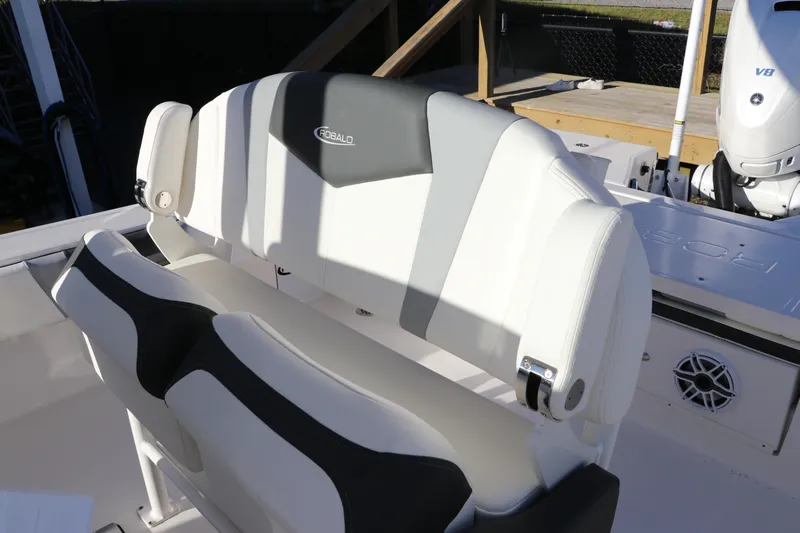 Slide: The Image of 2024 Robalo 266 Cayman boat seating with sleek black and white design. - 34