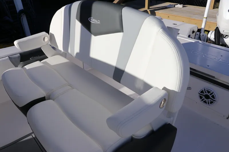 Slide: The Image of 2024 Robalo 266 Cayman boat seat with white and gray upholstery. - 35