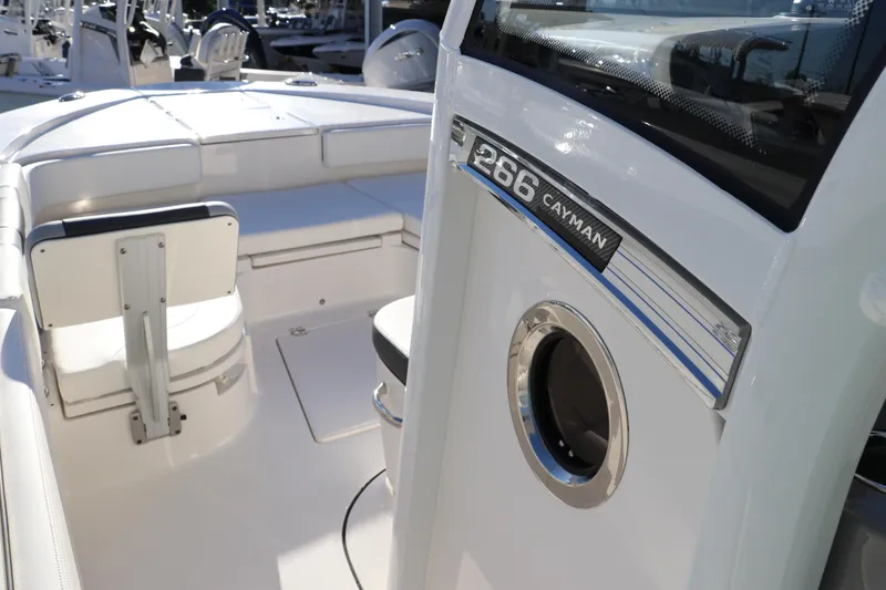 Slide: The Image of 2024 Robalo 266 Cayman boat interior with seating and console details. - 36
