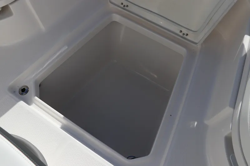 Slide: The Image of 2024 Robalo 266 Cayman storage compartment, open and empty. - 41