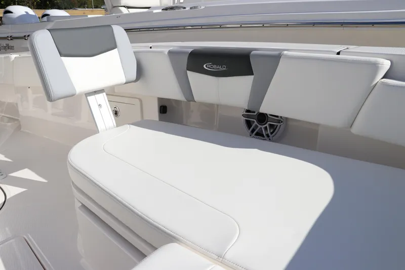 Slide: The Image of 2024 Robalo 266 Cayman boat interior with white cushioned seating. - 43
